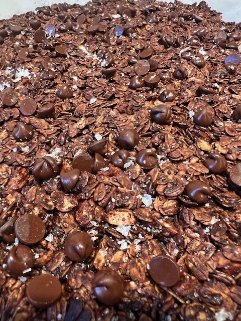 Picture of dark chocolate sea salt granola on a sheet pan.