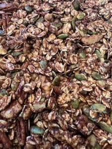 Picture of chai spiced granola on a sheet pan.