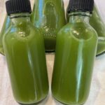 Picture of green juice wellness shot bottles.