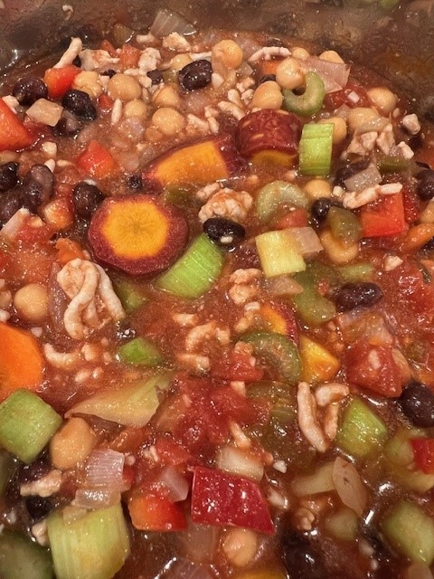 Picture of Instant Pot rainbow chili with ground meet, rainbow carrots, red bell peppers, celery, and tomatoes.