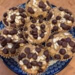 Picture of a plate of healthy oatmeal chocolate chip muffins on a blue and white plate.